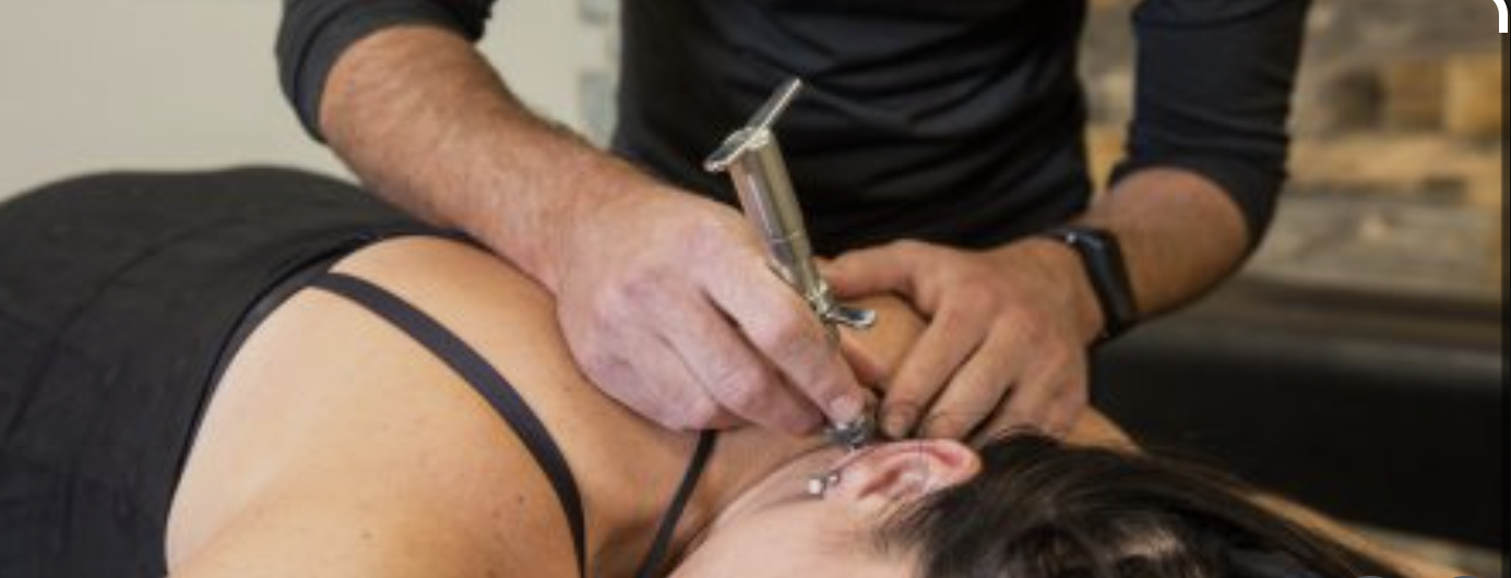 Dr. Gordon performing a gentle Torque Release Technique adjustment with The Integrator instrument